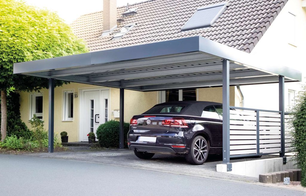 A car parked neatly under a carport, providing shelter from the elements.