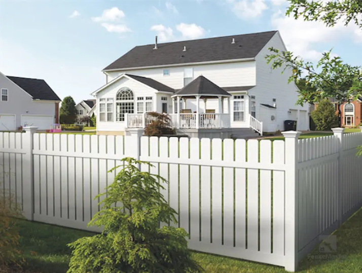 a white picket fence in front of a house